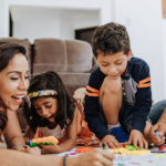 Latino parents playing with children