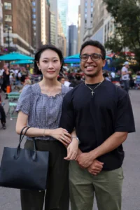 Young couple smiling at a community event
