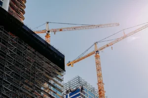 Construction cranes over a new building