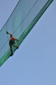 Worker on the glass facade of an office tower