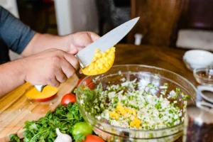 Person chopping vegetables for a meal