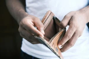 Hands opening an empty wallet