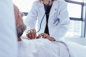 Doctorwithpatienthospital-696x464